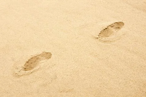 Footprints on the beach Stock Photos