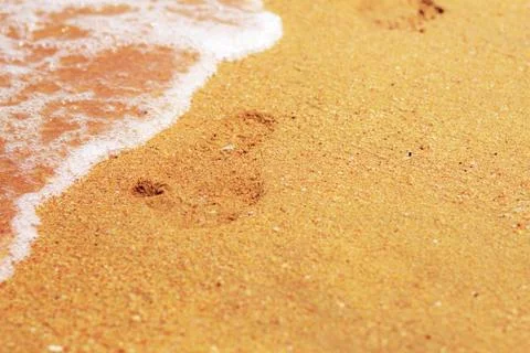 Footprints on beach. Stock Photos