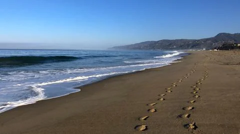 Footprints on beach Stock Photos