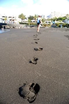 Footprints on the beach Stock Photos