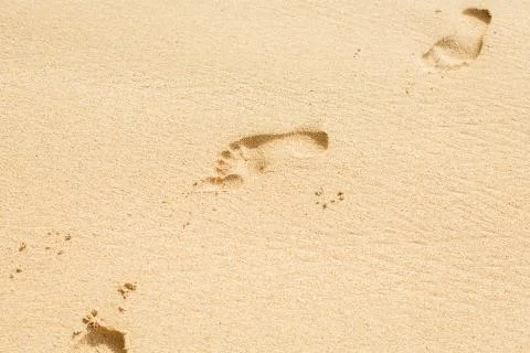 Footprints on beach sand Stock Photos