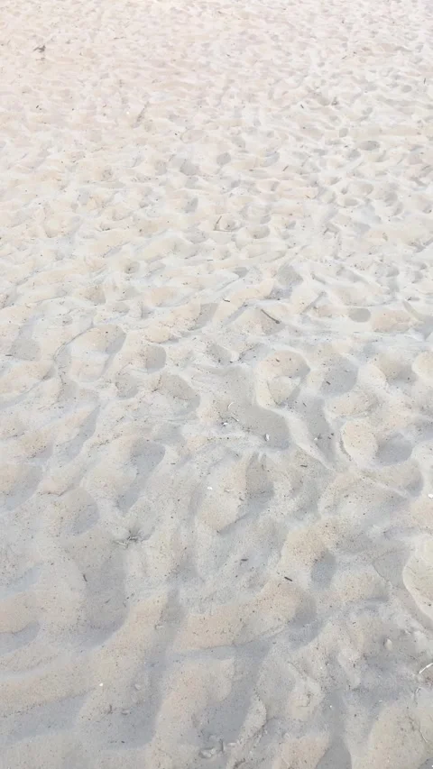Footprints on the beach sand. Summer. Vertical video Stock-Footage 282796893