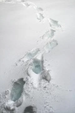 Footprints in deep snow Stock Photos