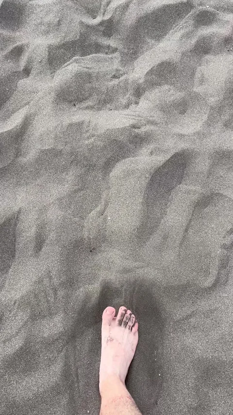 Footprints in fine, soft sand on a beautiful beach, capturing peaceful moments Stock Footage 318620130
