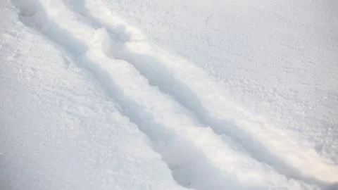 Footprints left in deep snow Stock Photos