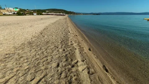 Footprints mark the shoreline, hinting at recent visitors. Trani Ammouda, Greece Stock Footage 339611305