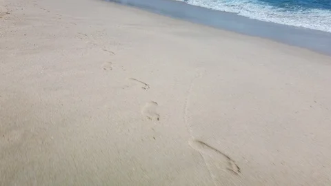 Footprints in the sad at shore. Stock Footage 114139532