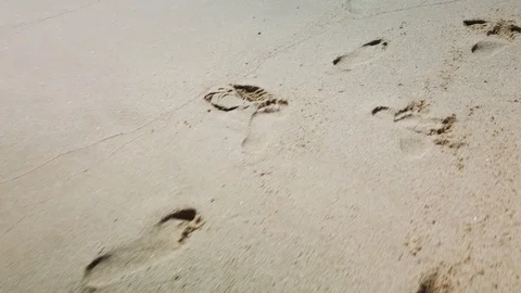 Footprints in the sad at shore. Stock Footage 114139852