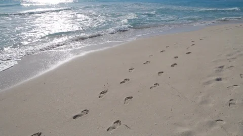 Footprints in the sand at beach. Video stock 91830936