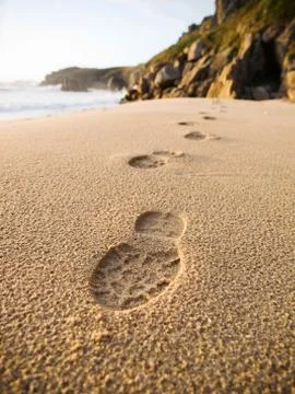 Footprints in the sand of the beach. Stock Photos