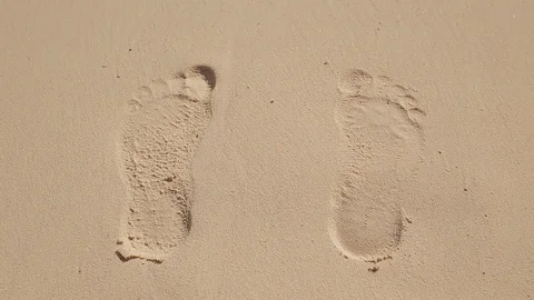 Footprints in the sand on the ocean Stock Footage 93317002