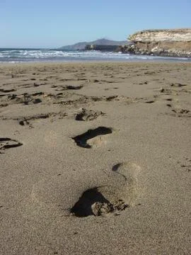 Footprints in the sand Stock-Fotos