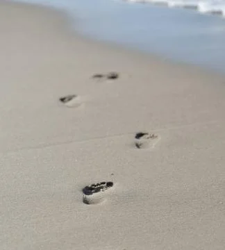 Footprints in the sand Stock Photos