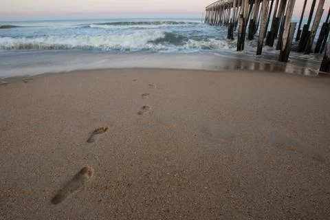 Footprints in sand Stock Photos