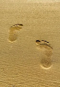 Footprints in sand Stock Photos