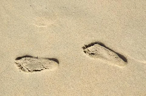Footprints in sand Stock Photos