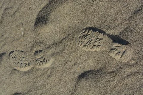 Footprints in sand Stock Photos