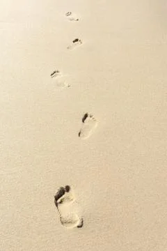 Footprints in the sand Stock-Fotos