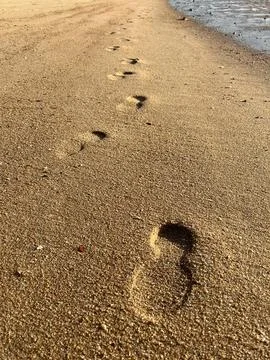Footprints in the sand Stock Photos