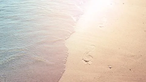 Footprints on sandy beach. Stock Photos