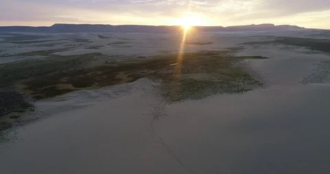 Footprints in the sandy sunrise Stock Footage 96356360
