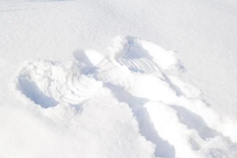 Footprints in the snow angel Stock Photos
