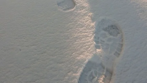 Footprints in the snow. Panning in slow motion Stock Footage 85226541