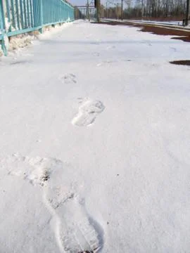 Footprints in the snow Stock Photos