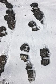 Footprints in the snow Stock Photos