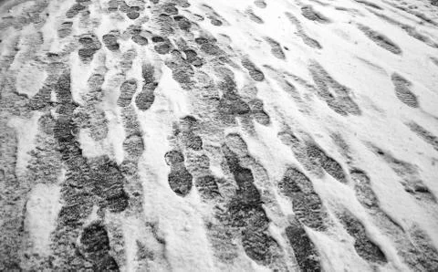 Footprints in snow Stock Photos