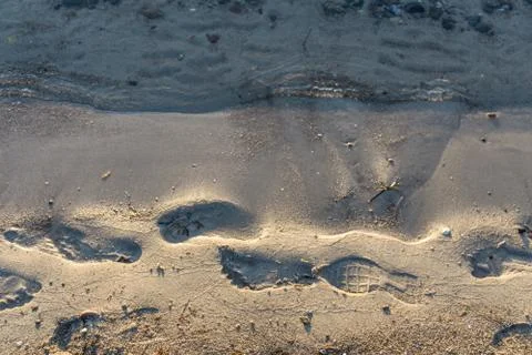 Footprints on the water's edge Stock Photos