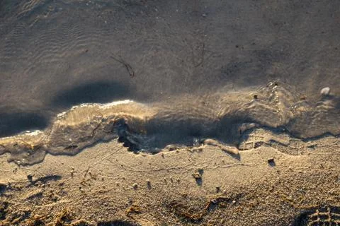 Footprints on the water's edge Stock Photos