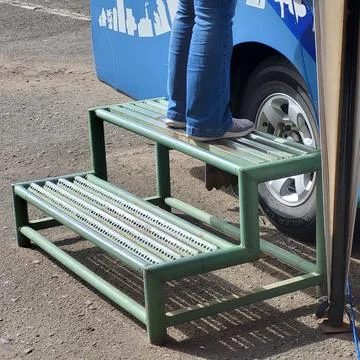 Footrest to get on the bus Stock Photos