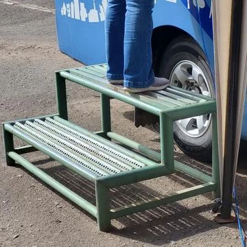Footrest to get on the bus Stock Photos
