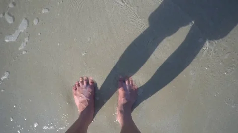 Foots on Sand in beautiful beach Stock Footage 73398166