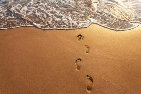Footsteps on the beach. Stock Photos