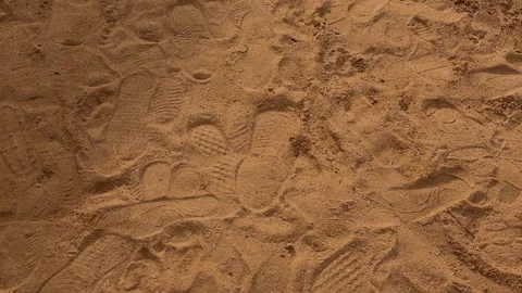 Footsteps Blend Into Sandy Shore. Marks Pressed Into Warm Sand Shape Coastal Stock Footage 337939805