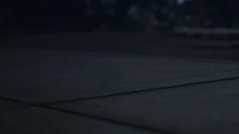 Footsteps on a dark street create sounds in the night air during late hours Stock Footage 344968854