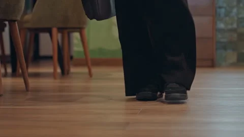 Footsteps on flooring. Individual strolling on polished wooden surface Stock Footage 341665487