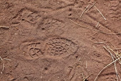 Footsteps on ground - pattern people marks Stock Photos