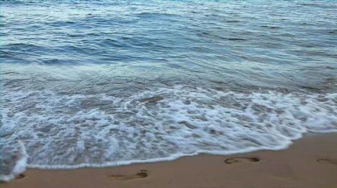 Footsteps on the sand and wave Stock Footage 530101