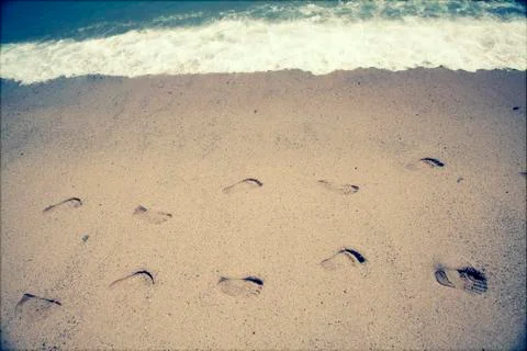 Footsteps in the sand Stock Photos