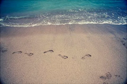 Footsteps in the sand Stock Photos