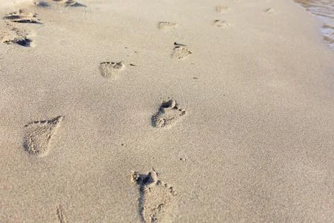 Footsteps on the sand Stock Photos