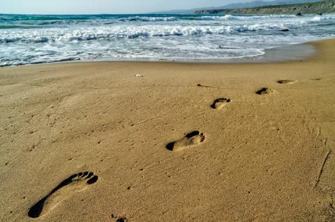 Footsteps on the sand Stock Photos