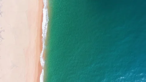 Footsteps on the sandy beach lead to the blue ocean in Bien Lo Quang. Waves Stock Footage 340251874