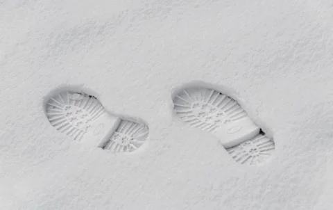Footsteps in the snow, boot mark close up outdoor Stock Photos