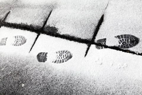 Footsteps in snow Stock Photos
