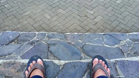 Footwear on Cobblestone Path Stock Photos