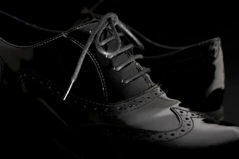 Footwear Concept. Horizontal Image. Pair of black female classic leather shoe Stock Photos